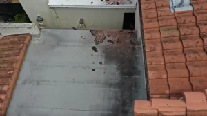 Wind damaged shingle roof after a storm